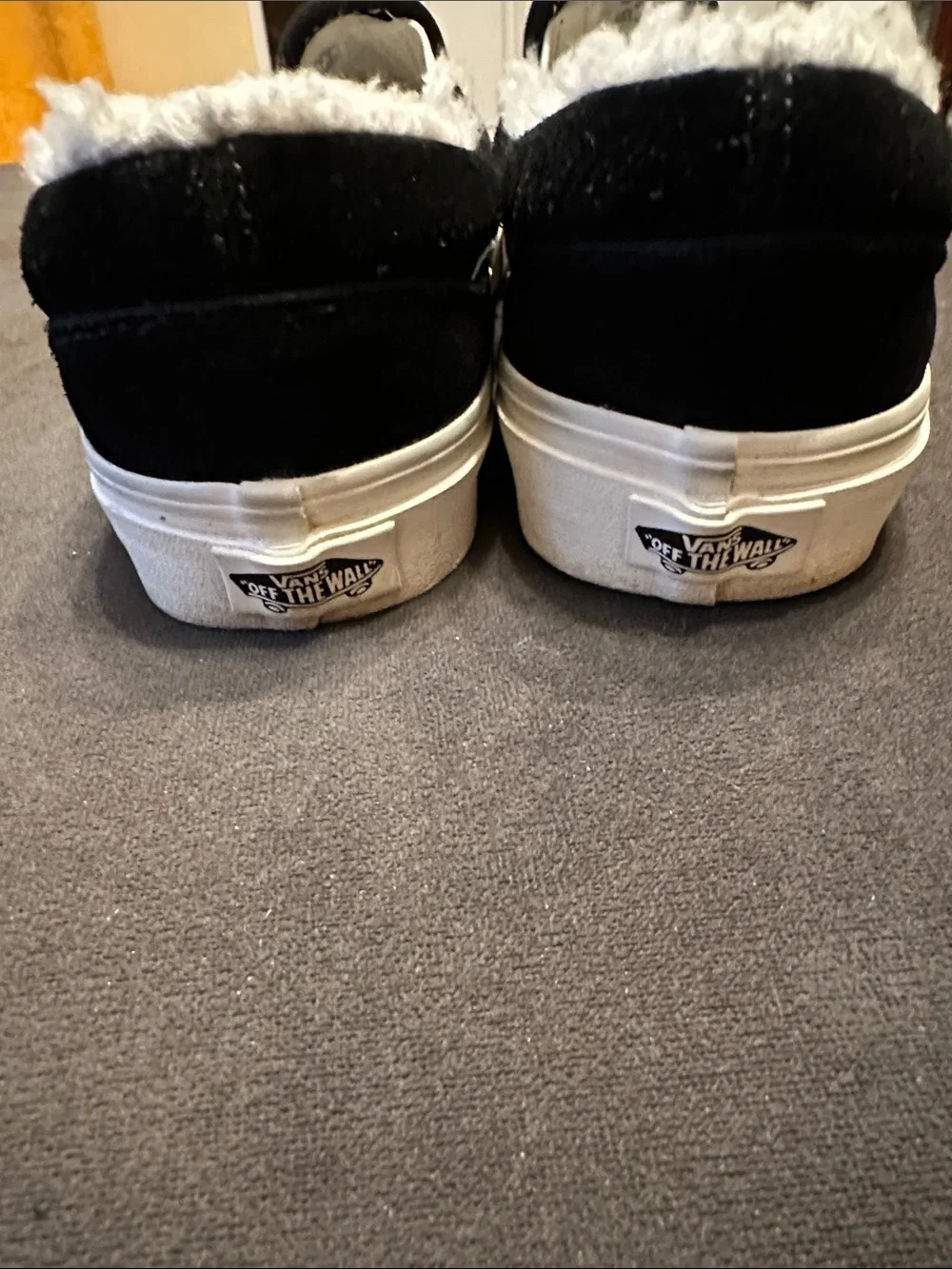 Vans Black Slip-On Sneakers with White Faux Fur Trim